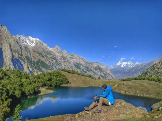 The stunning Kutwal Lake surrounded by green meadows