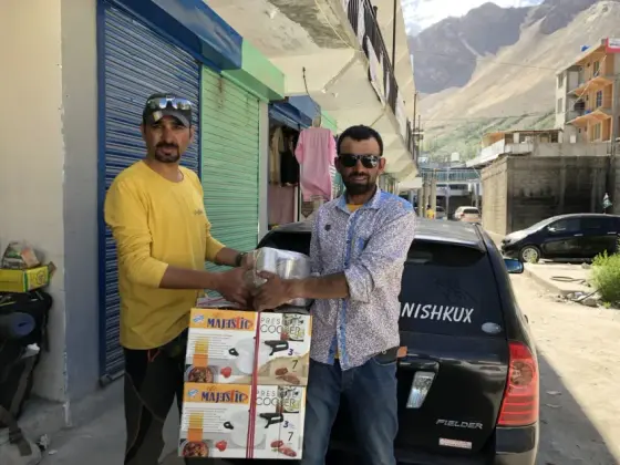 Donating cookers and steel mugs at Shimshal Pass camps